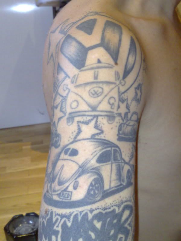 http://i77.photobucket.com/albums/j74/funkmasterred/my%20tattoos/01022008990.jpg