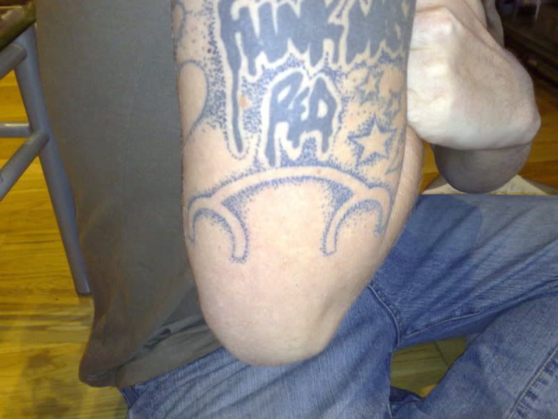 http://i77.photobucket.com/albums/j74/funkmasterred/my%20tattoos/25102007730.jpg