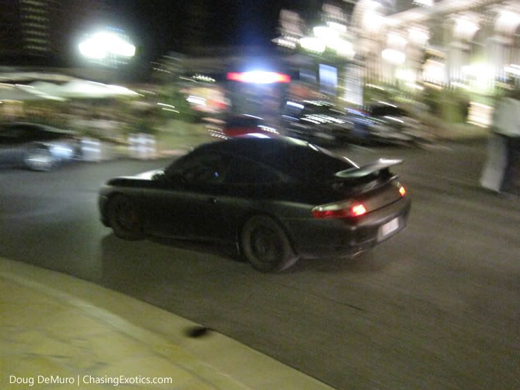 matte black Porsche 911 GT3 [996] on Monaco plates.