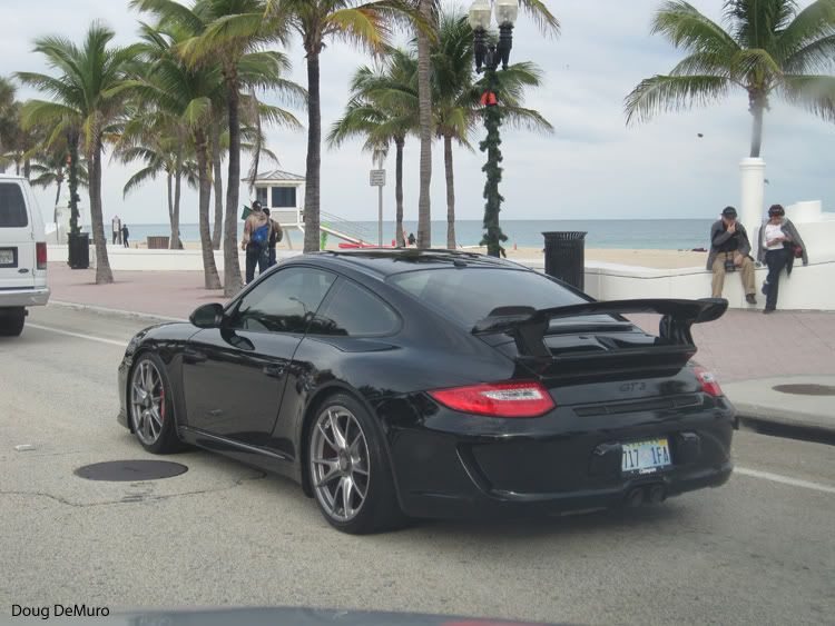 black Porsche 911 GT3 997 II on Imagine plates on Seabreeze Boulevard in 