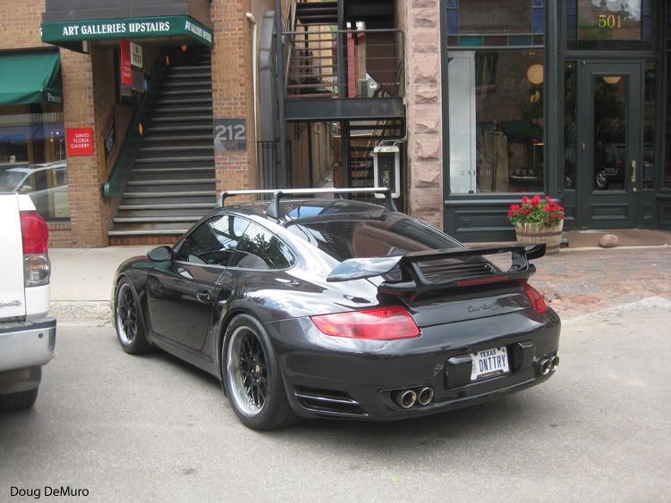 a black Porsche 911 Turbo S 997 on Texas plates supporting TCU with ski 