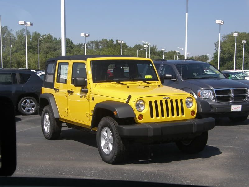 Yellow four door jeep wrangler for sale